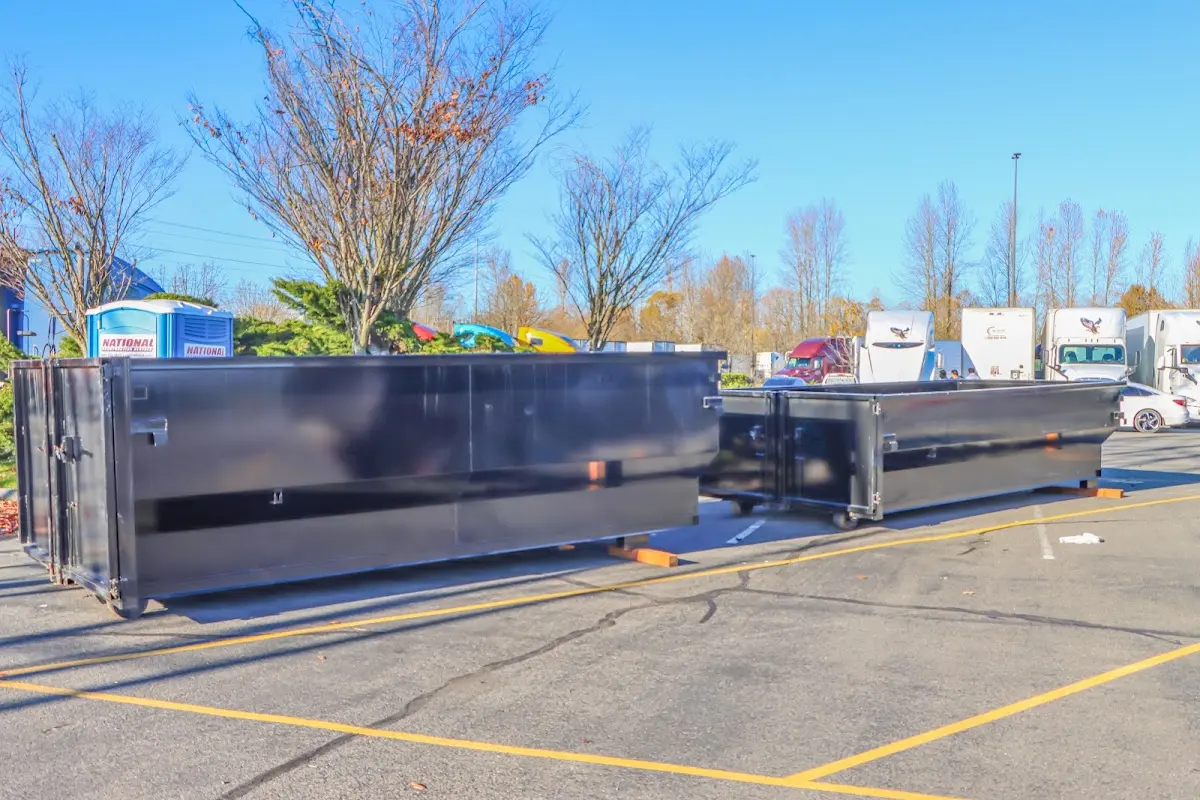 Professional dumpster rental service with roll-off container on residential driveway in Upper Southampton